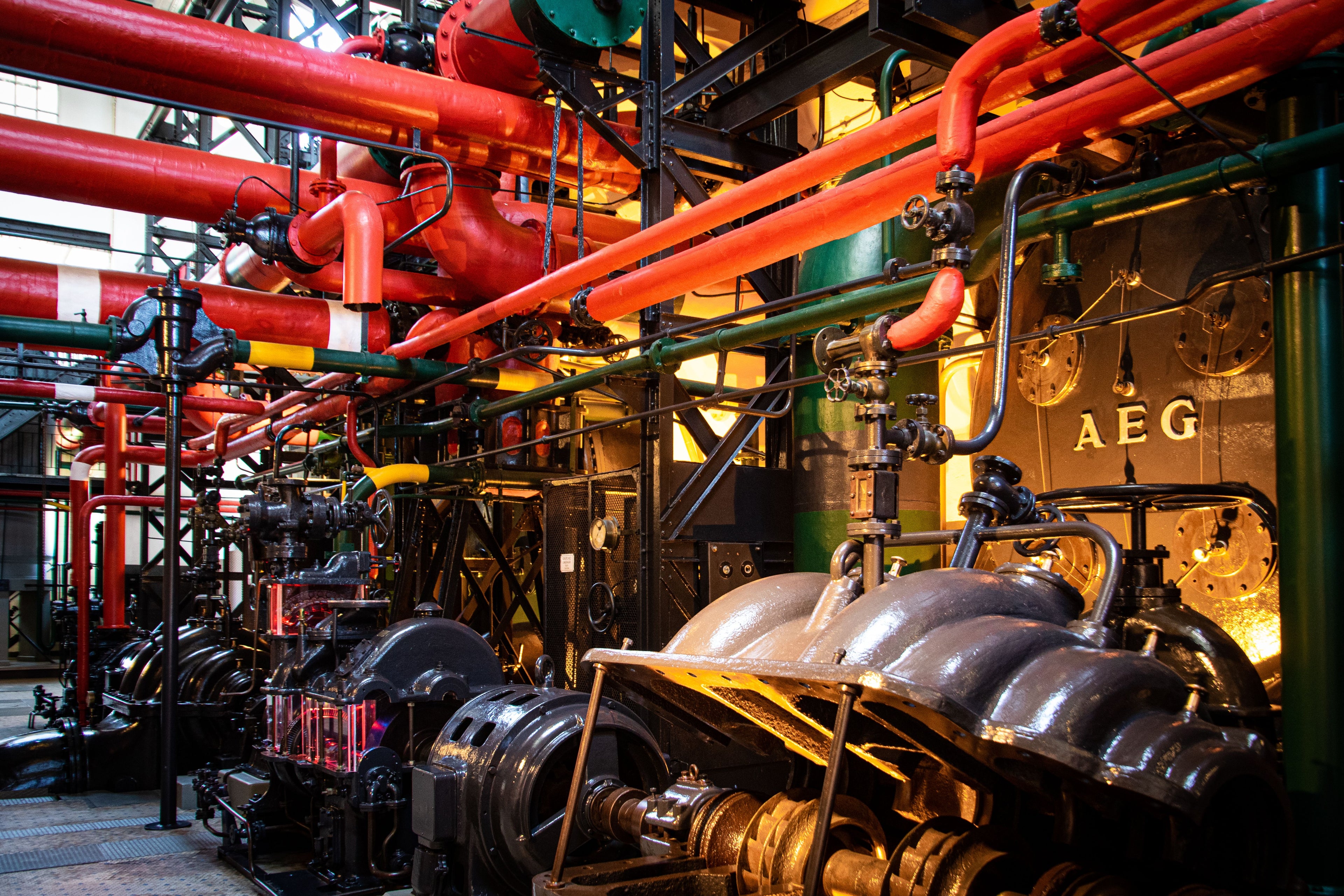 Industrial pump machinery with red pipes